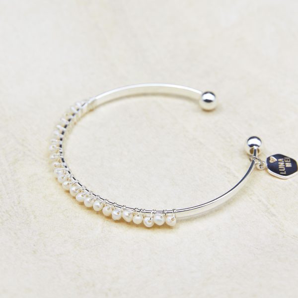 Lune cuff bracelet with delicate freshwater pearl strand