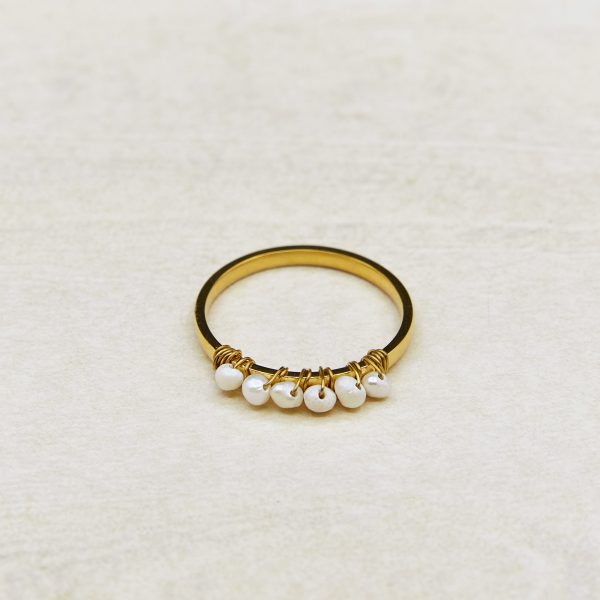 Arwen pearl ring with tiny freshwater pearls threaded on a fine band