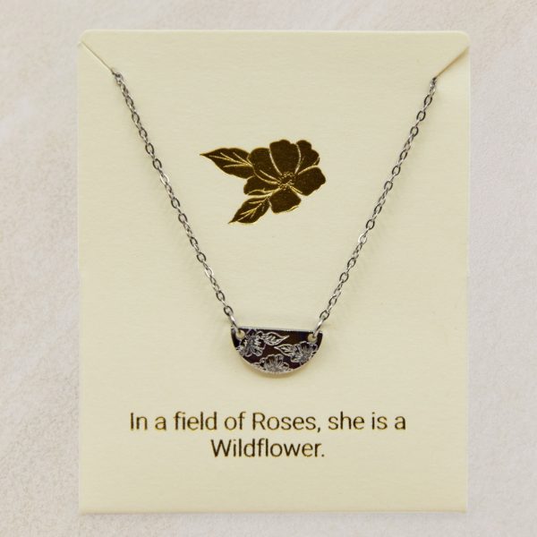silver necklace with flower engraving